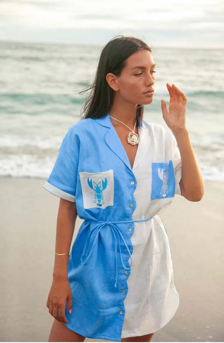 This dress pairs effortlessly with beachwear essentials like sandals, shell jewelry (as worn by the model), and a sunhat.