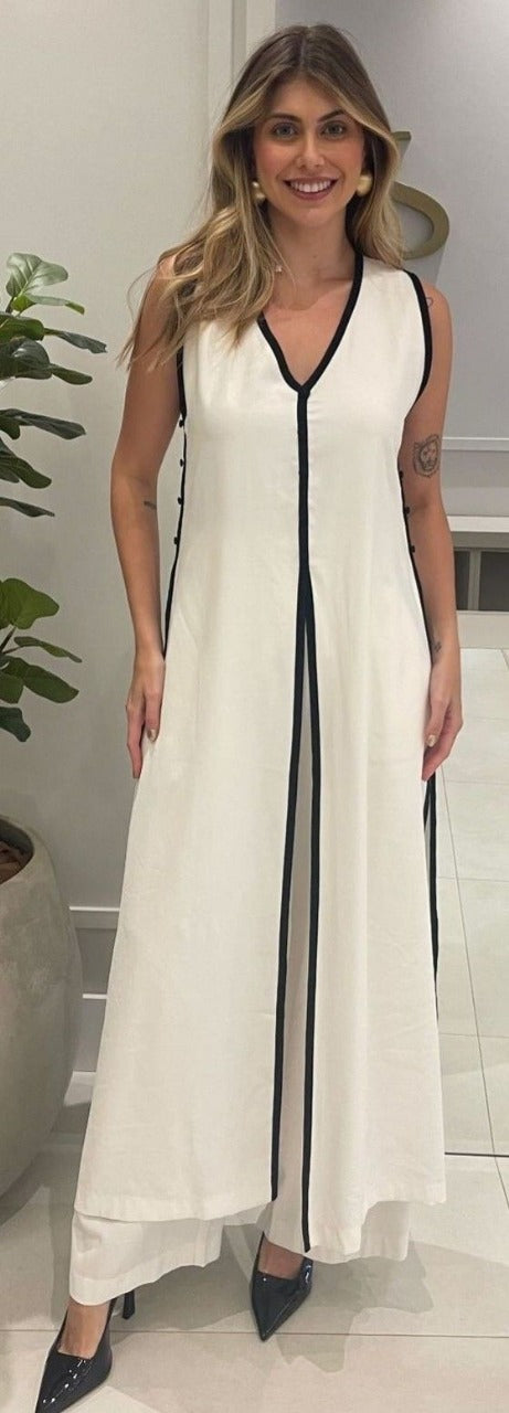 An elegant and flowy white jumpsuit or maxi dress with an A-line cut and wide legs.
