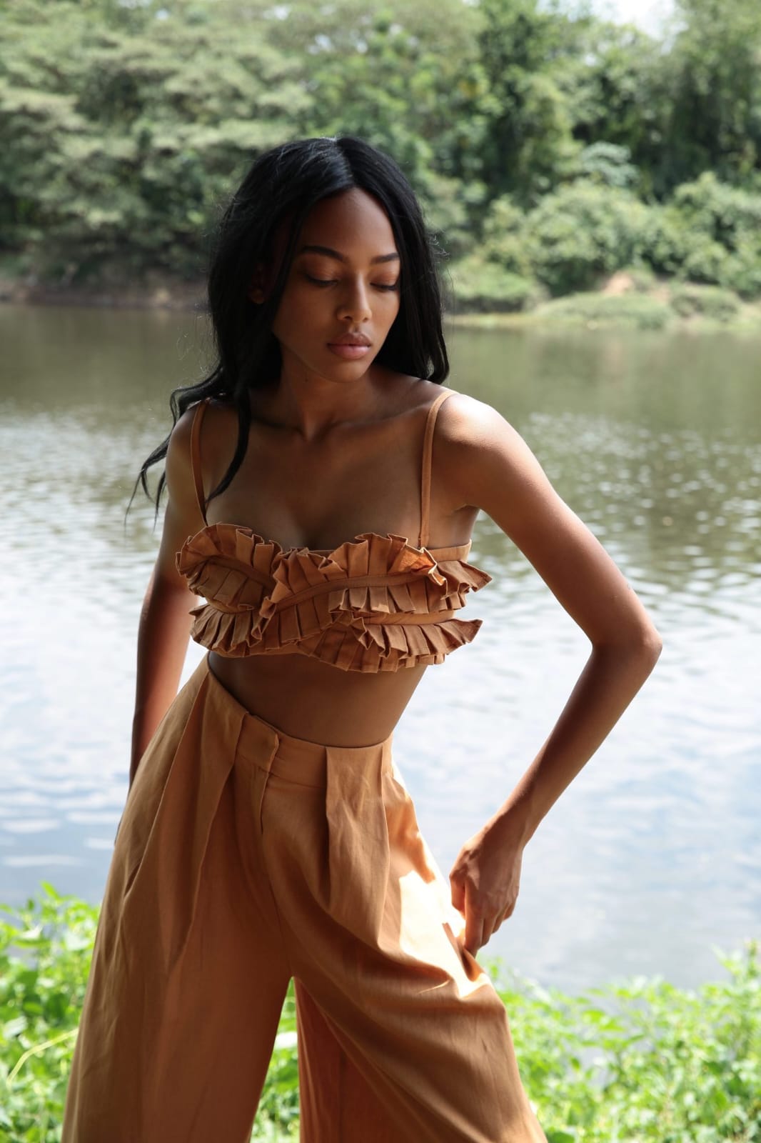 chic two-piece co-ord set in a warm caramel or camel brown shade, blending softness with subtle drama for a relaxed yet fashion-forward aesthetic.