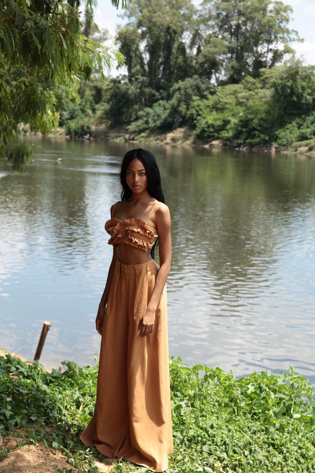 chic two-piece co-ord set in a warm caramel or camel brown shade, blending softness with subtle drama for a relaxed yet fashion-forward aesthetic.