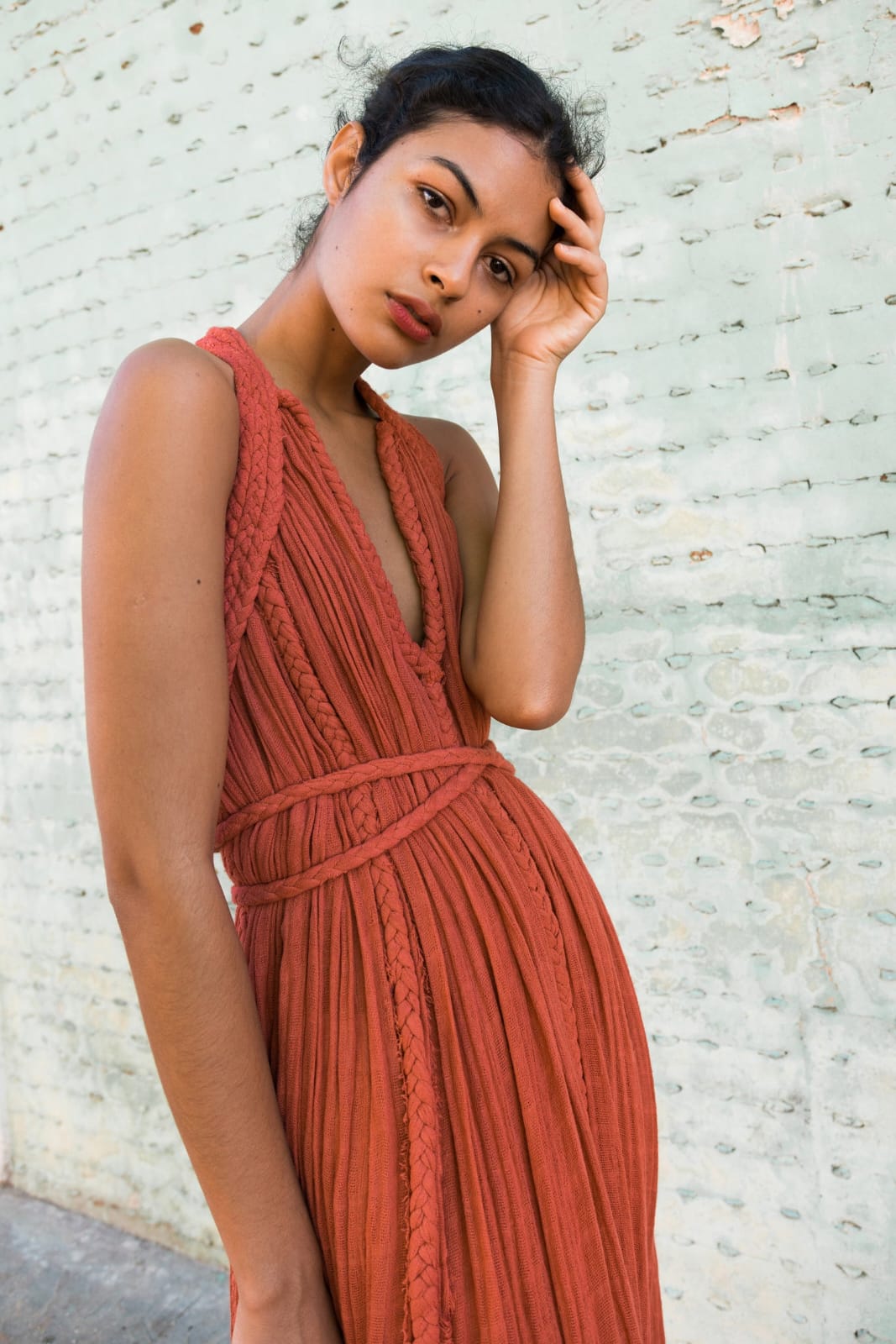 rust-orange bohemian maxi dress with a flowy, textured silhouette and unique rope detailing. It’s both effortless and artistic, perfect for someone who wants to make a natural yet bold statement.