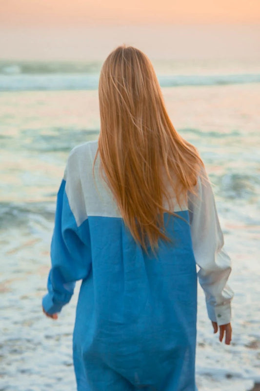 This dress pairs effortlessly with beachwear essentials like sandals, shell jewelry (as worn by the model), and a sunhat.