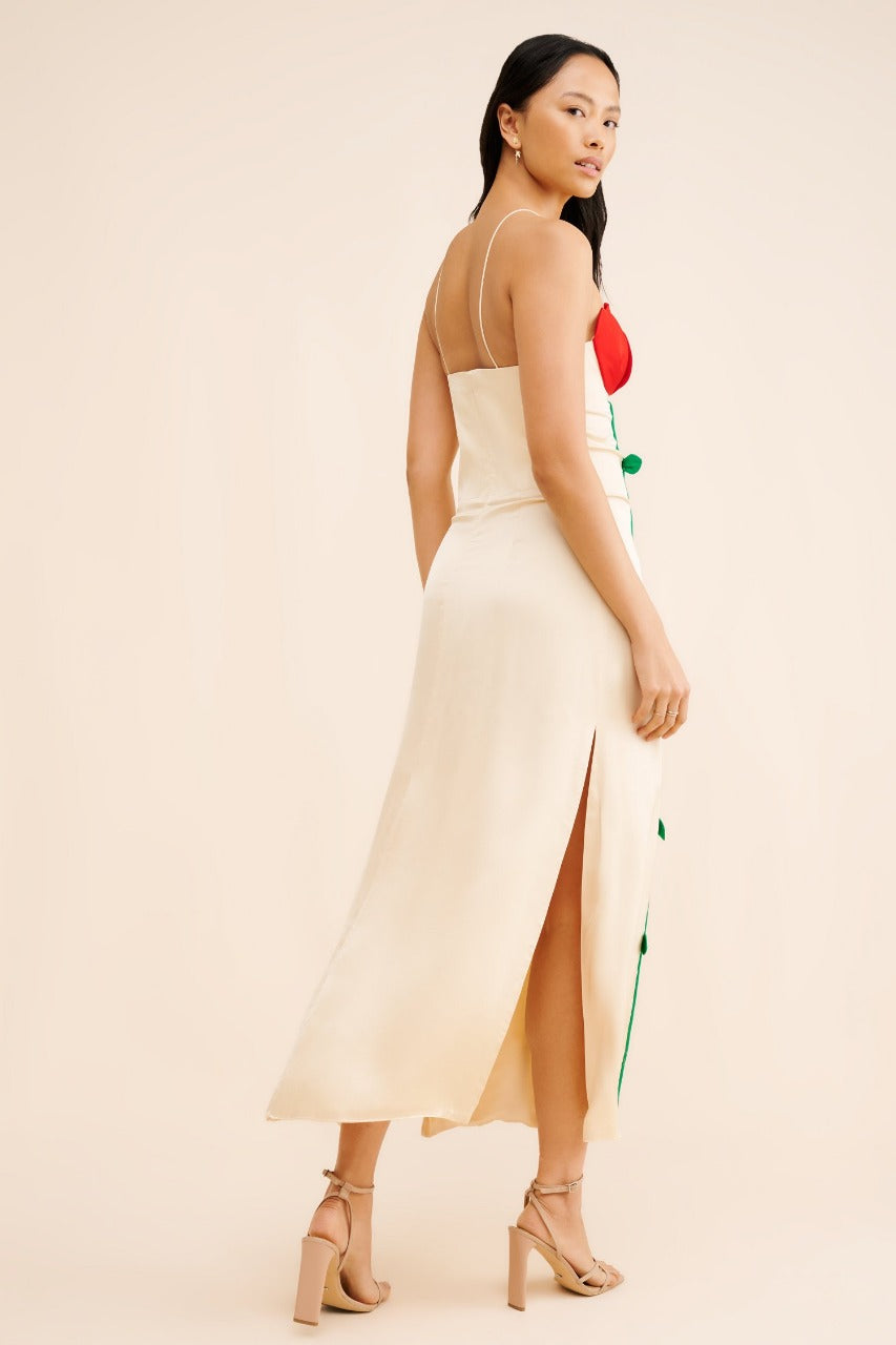 A striking and creative bodycon dress with a playful botanical twist.