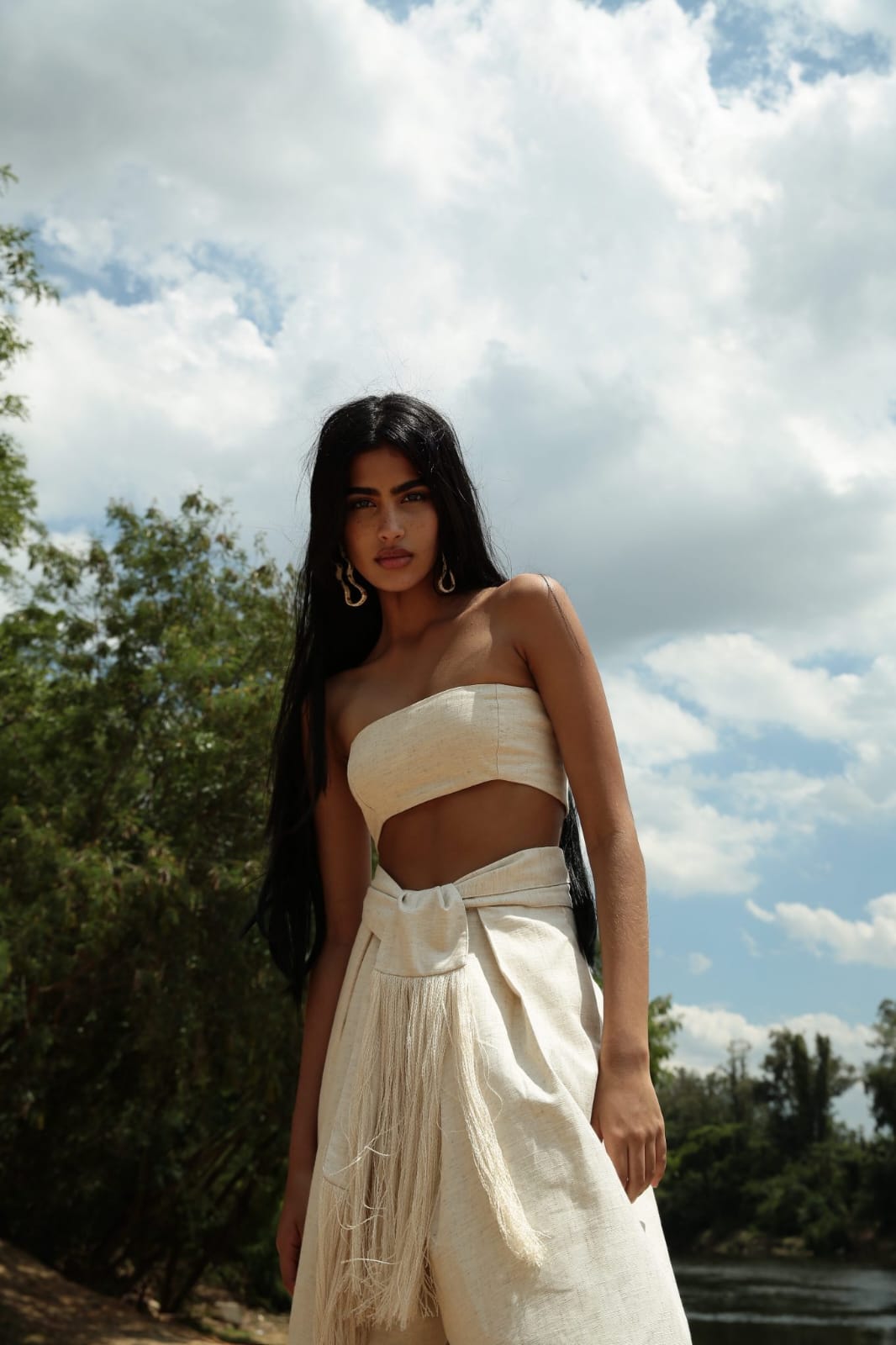 minimalist, boho-inspired two-piece co-ord set in a soft off-white or natural beige tone, perfect for warm-weather styling with a raw, earthy elegance.