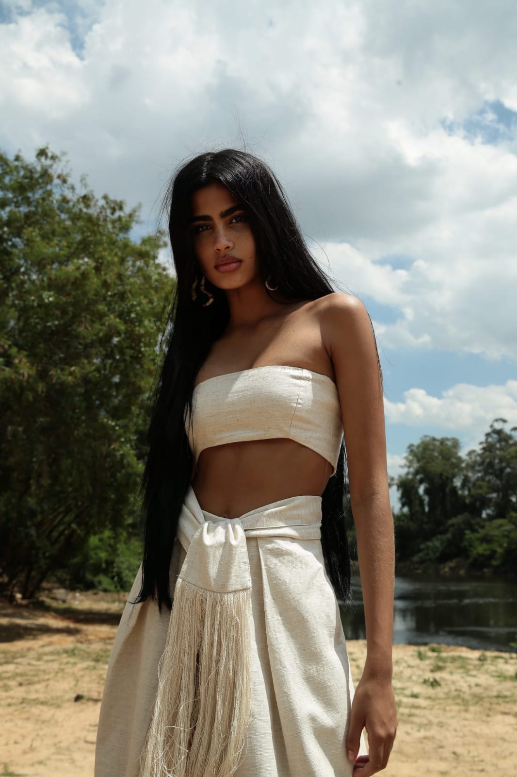 minimalist, boho-inspired two-piece co-ord set in a soft off-white or natural beige tone, perfect for warm-weather styling with a raw, earthy elegance.