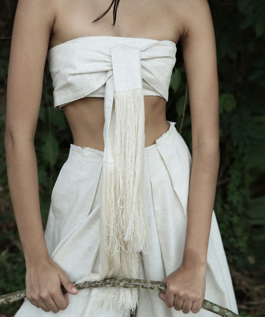 minimalist, boho-inspired two-piece co-ord set in a soft off-white or natural beige tone, perfect for warm-weather styling with a raw, earthy elegance.